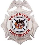 VOLUNTEER FIREFIGHTER METAL SHIRT BADGE.